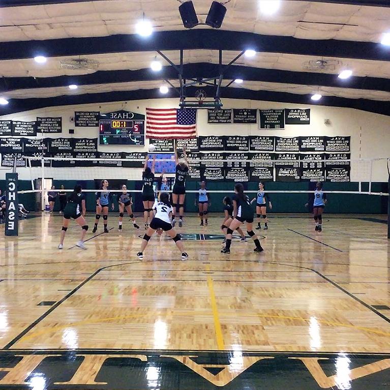 The Chase Collegiate Middle School girls' volleyball team plays in a match.